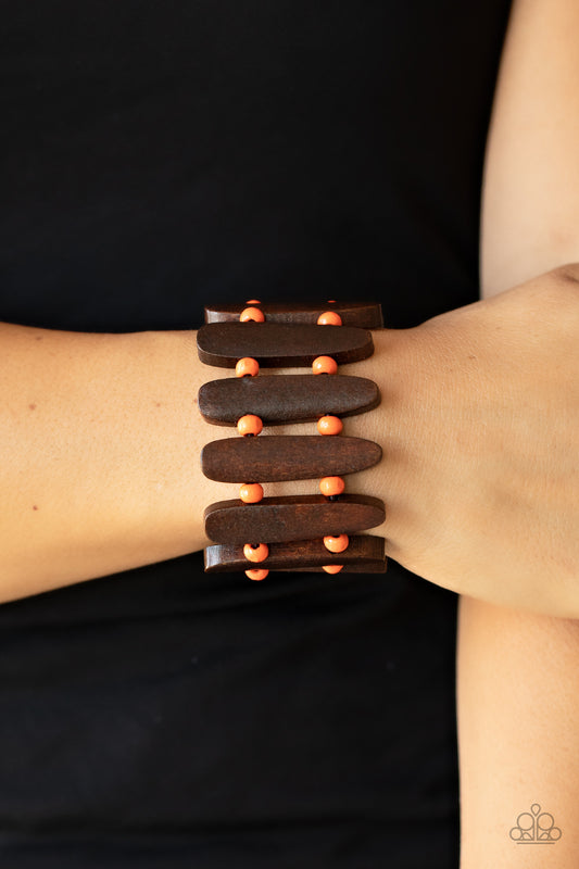 Coronado Cabana Orange Wooden Bracelet - Paparazzi Accessories  Pairs of Burnt Orange wooden beads and oblong brown wooden frames alternate along stretchy bands around the wrist for a seasonal pop of color.  All Paparazzi Accessories are lead free and nickel free!  Sold as one individual bracelet.