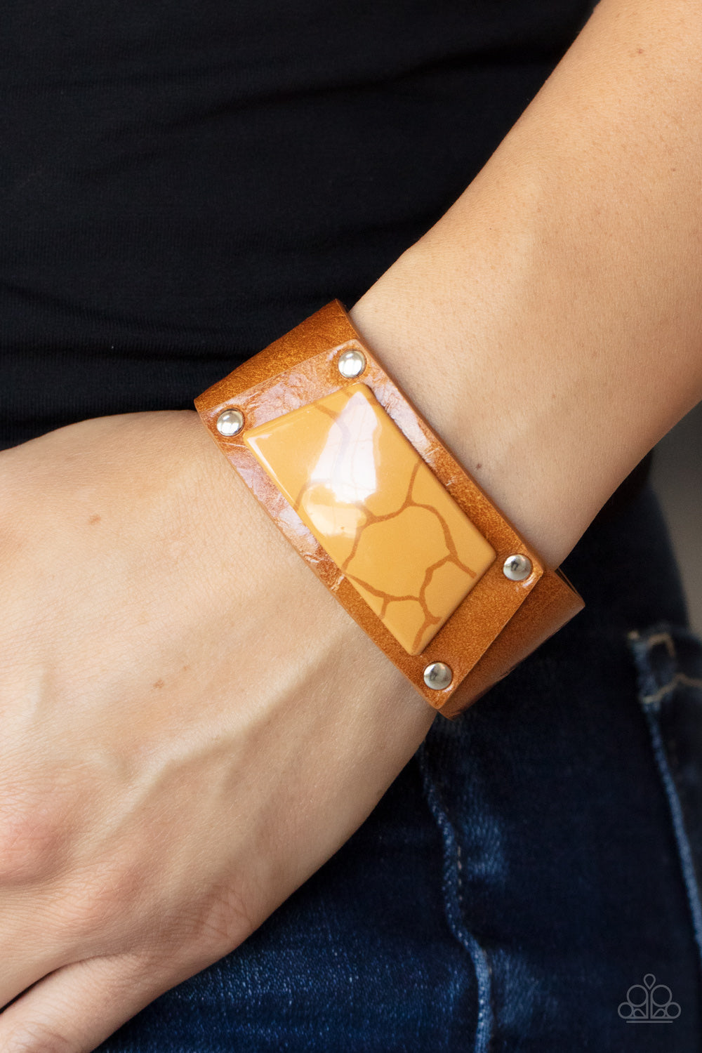 Geo Glamper Brown Wrap Bracelet - Paparazzi Accessories  Featuring a faux marble finish, a brown acrylic centerpiece attaches to a tan leather frame that is studded in place along a distressed tan leather band for a colorfully rustic fashion. Features an adjustable snap closure.  Sold as one individual bracelet.