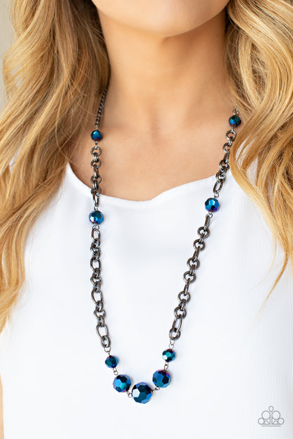 Prismatic Pick-Me-Up Multi Necklace - Paparazzi Accessories  Featuring an oil spill iridescence, faceted metallic blue beads adorn sections of chunky gunmetal chains across the chest for a gritty glamorous fashion. Features an adjustable clasp closure.  Sold as one individual necklace. Includes one pair of matching earrings.