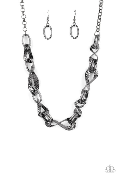 METAL of Honor Black Necklace - Paparazzi Accessories  Hammered and embossed in geometric detail, pairs of gunmetal links connect with twisting gunmetal oval fames below the collar for an edgy, but refined look. Features an adjustable clasp closure.  Sold as one individual necklace. Includes one pair of matching earrings.