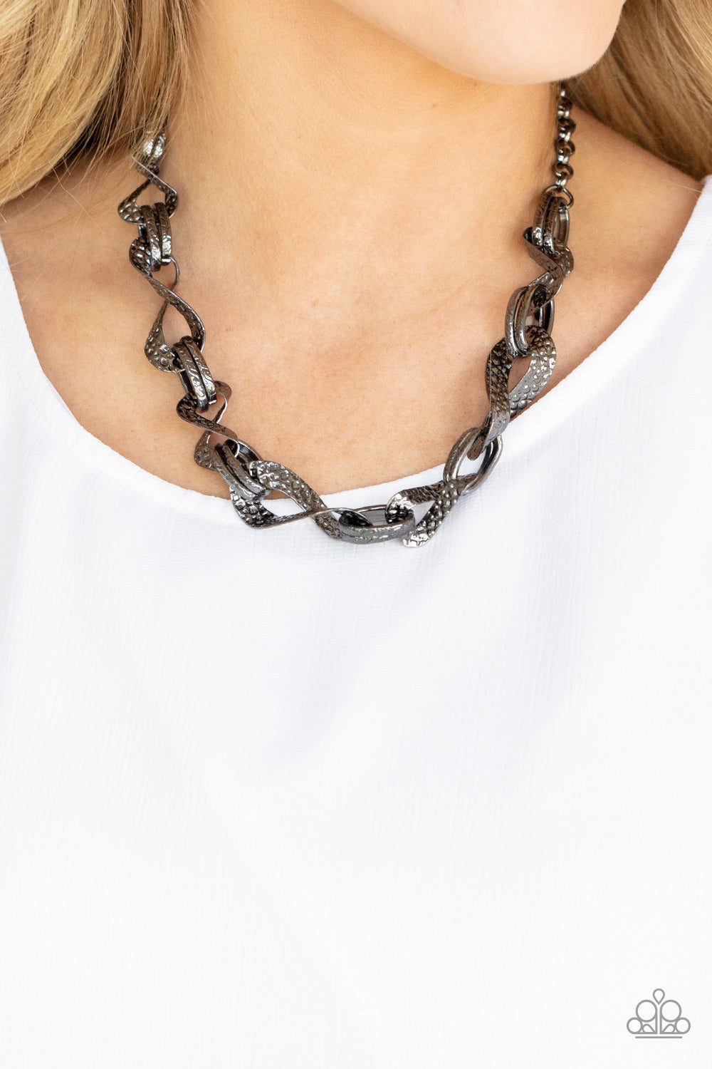 METAL of Honor Black Necklace - Paparazzi Accessories  Hammered and embossed in geometric detail, pairs of gunmetal links connect with twisting gunmetal oval fames below the collar for an edgy, but refined look. Features an adjustable clasp closure.  Sold as one individual necklace. Includes one pair of matching earrings.