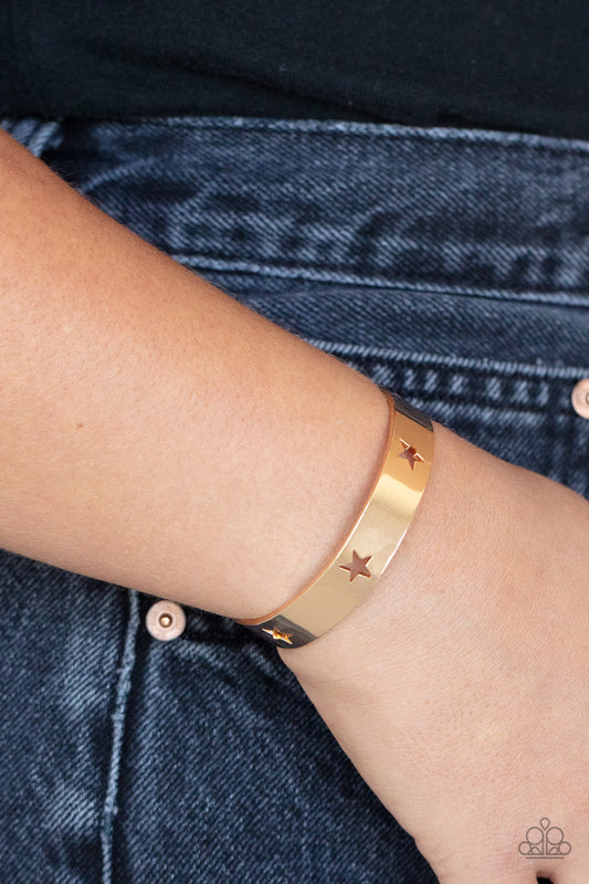 American Girl Glamour Gold Cuff Bracelet - Paparazzi Accessories  Airy gold stars are cutout along a classic gold cuff, creating a stellar centerpiece around the wrist.  Sold as one individual bracelet.