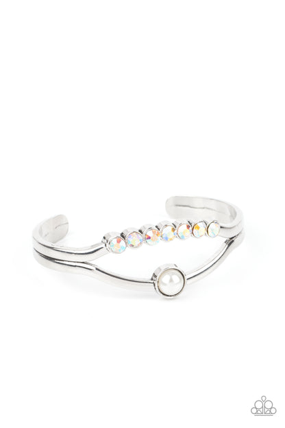 Palace Prize Multi Cuff Bracelet - Paparazzi Accessories  A row of iridescent rhinestones and a solitaire white pearl adorn the layered center of a classic silver cuff, creating a timeless piece around the wrist.  All Paparazzi Accessories are lead free and nickel free!   Sold as one individual bracelet.