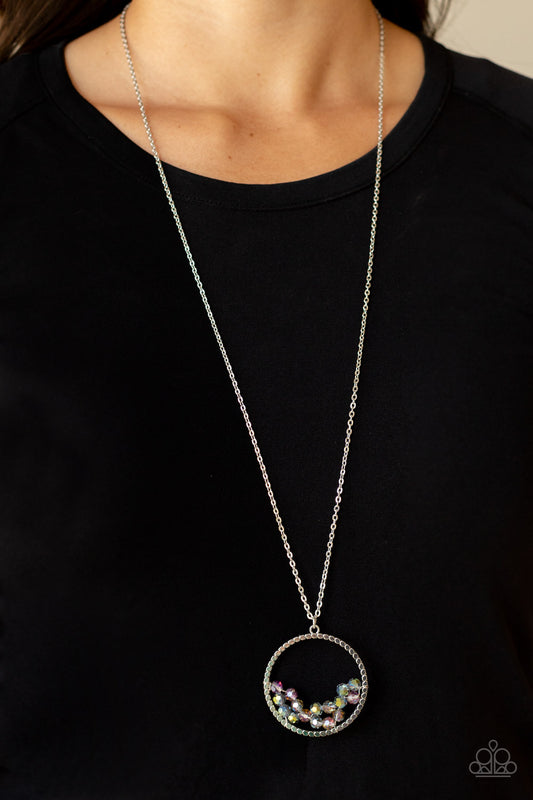 Galactic Glow Multi Necklace - Paparazzi Accessories  A cluster of metallic flecked and iridescent crystal-like beads are threaded along dainty silver wire along the bottom of a textured silver hoop, creating a stellar pendant at the bottom of a lengthened silver chain. Features an adjustable clasp closure.  Sold as one individual necklace. Includes one pair of matching earrings.