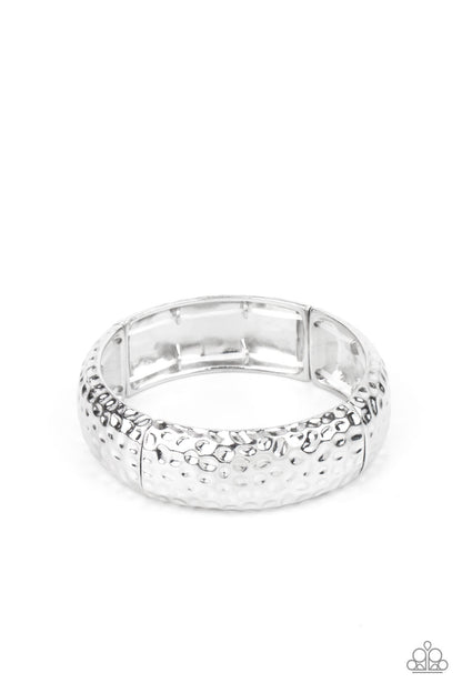 Come Under The Hammer Silver Bracelet - Paparazzi Accessories  Hammered in rustic textures, curved silver rectangular frames are threaded along stretchy bands around the wrist for an artisan inspired look.  Sold as one individual bracelet.