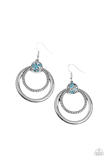 Spun Out Opulence Blue Earring - Paparazzi Accessories  Smooth and textured silver hoops connect to the bottom of a silver fitting embellished in glitzy blue and hematite rhinestones, creating a dizzying lure. Earring attaches to a standard fishhook fitting.  All Paparazzi Accessories are lead free and nickel free!   Sold as one pair of earrings.