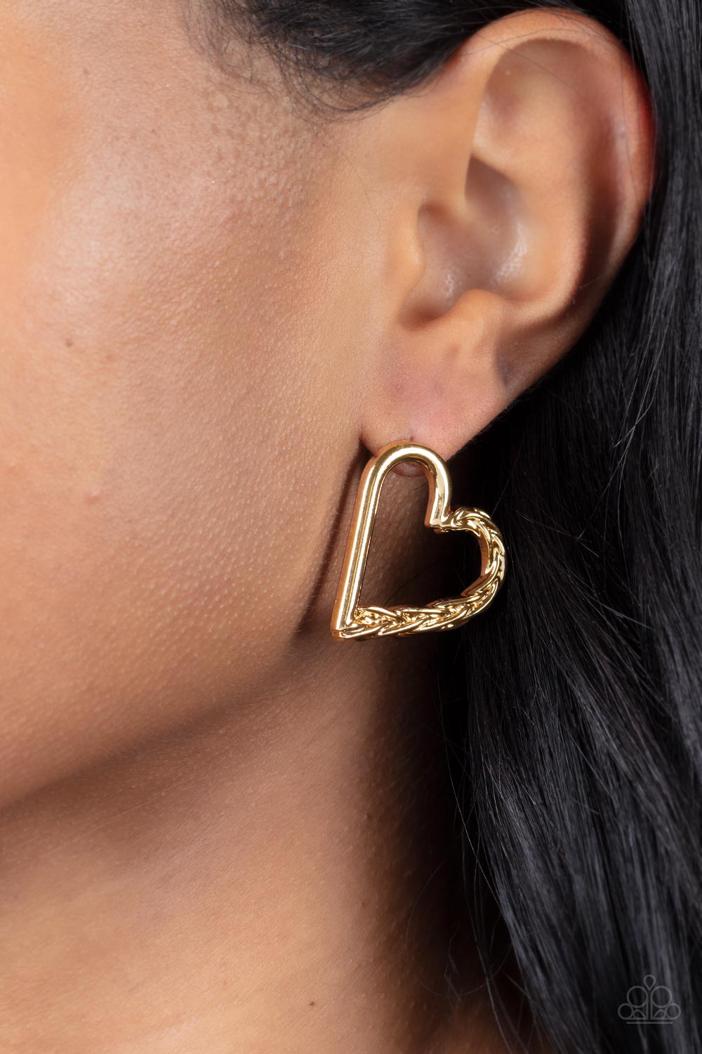 Cupid, Who? Gold Post Earring - Paparazzi Accessories  One side of a glistening gold heart frame is subtlety twisted with twinkly texture, creating a romantic display. Earring attaches to a standard post fitting.  All Paparazzi Accessories are lead free and nickel free!  Sold as one pair of post earrings.