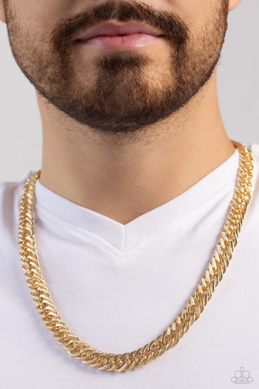 In The END ZONE Gold Unisex Necklace - Paparazzi Accessories  Etched in edgy shimmer, oversized gold links boldly interconnect across the chest for a standout fashion. Features an adjustable clasp closure.  Sold as one individual necklace.  Sku:  P2MN-URGD-038XX