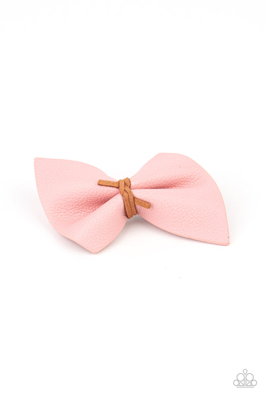 Home Sweet HOMESPUN Pink Hair Clip - Paparazzi Accessories  Brown suede cording knots around the middle of a piece of Pale Rosette leather, creating a rustic bow. Features a standard hair clip on the back.  Sold as one individual hair clip.