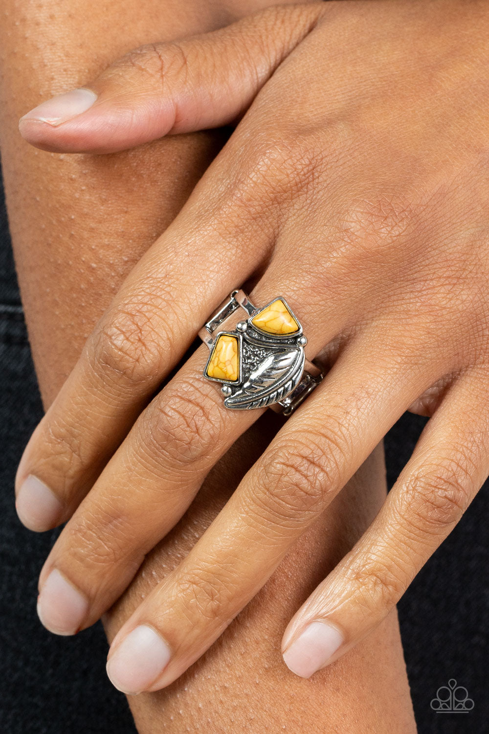 Make the NEST of It Yellow Ring - Paparazzi Accessories  Asymmetrical yellow stones adorn the front of an antiqued silver frame adorned in a silver feather, creating a rustic centerpiece atop the finger. Features a stretchy band for a flexible fit.  Sold as one individual ring.