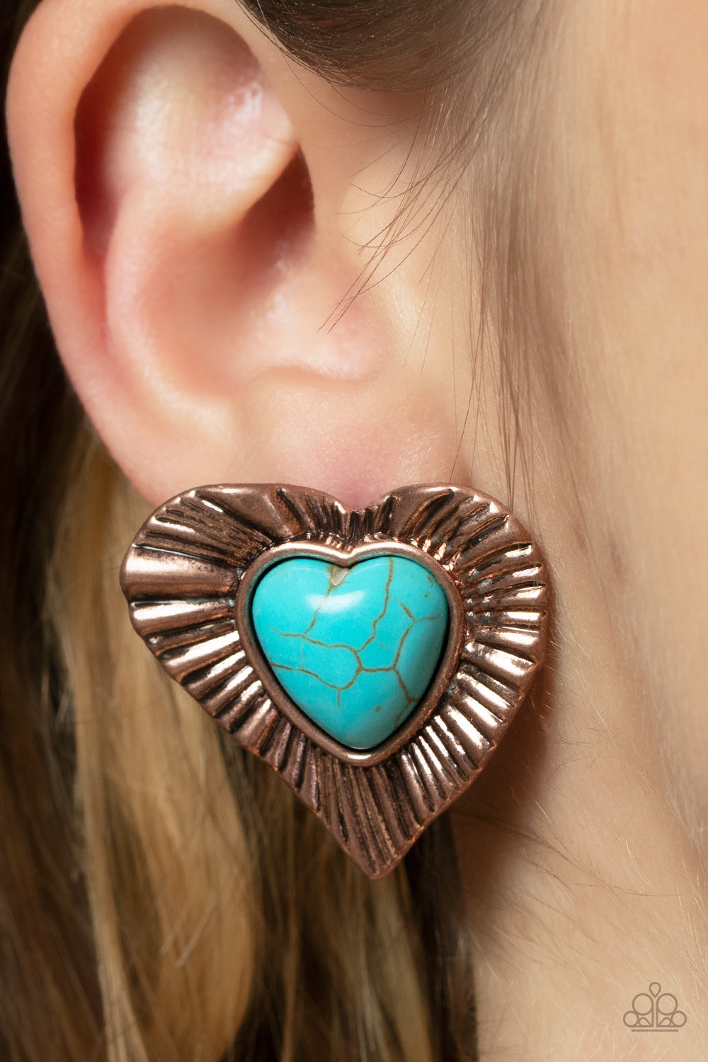 Rustic Romance Copper Post Earring - Paparazzi Accessories  Etched in rustic texture, an antiqued copper frame gathers around a heart shaped turquoise stone center, creating a romantic display. Earring attaches to a standard post fitting.  Sold as one pair of post earrings.