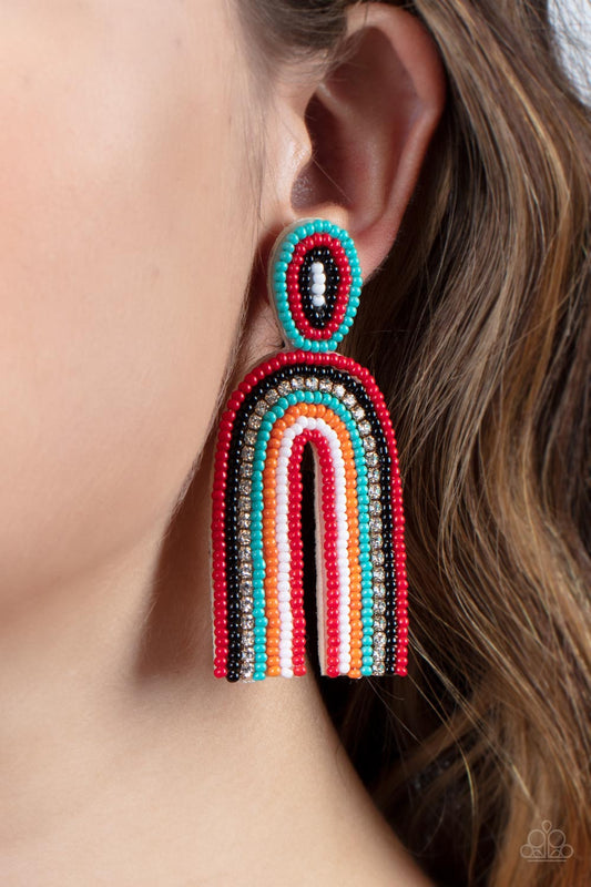 Rainbow Remedy Multi Seed Bead Earring - Paparazzi Accessories  Infused with a single row of glassy white rhinestones, dainty strands of red, black, turquoise, orange, white, and red seed beads stack into a colorful rainbow at the bottom of a matching seed beaded fitting. Earring attaches to a standard post fitting.  Sold as one pair of post earrings.