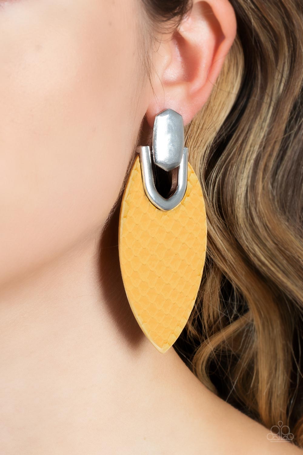 Wildly Workable Yellow Leather Earring - Paparazzi Accessories  Featuring python-like texture, an oval yellow leather frame attaches to a bold silver fitting, creating a wild lure. Earring attaches to a standard post fitting.  Sold as one pair of post earrings.  P5PO-YWXX-029XX
