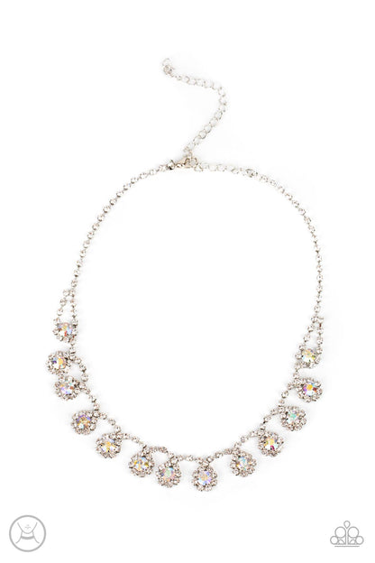 Princess Prominence Multi Choker Necklace - Paparazzi Accessories  A dainty strand of glittery white rhinestones encircle solitaire iridescent rhinestones around the neck, creating a glitzy fringe. Features an adjustable clasp closure.  Sold as one individual choker necklace. Includes one pair of matching earrings.