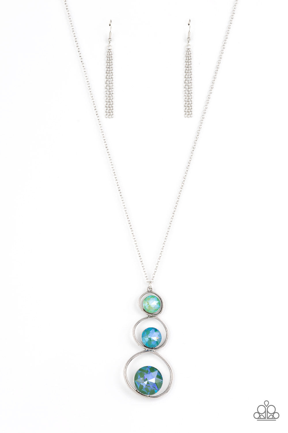 Celestial Courtier Green Necklace - Paparazzi Accessories  A sparkly ombré of opalescent green gems adorn the bottoms of three silver hoops that gradually increase in size as they stack into an asymmetrical pendant. The glowing pendant swings from the bottom of a lengthened silver chain, creating a stellar centerpiece. Features an adjustable clasp closure.  Sold as one individual necklace. Includes one pair of matching earrings.