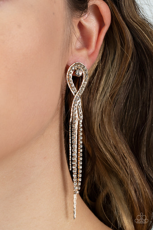 Luxury Lasso Gold Earring - Paparazzi Accessories  A lasso of glassy white rhinestones nestles around a solitaire white rhinestone, while a tassel of flat gold chains stream out from the bottom for a glamorous finish. Earring attaches to a standard post fitting.  Sold as one pair of post earrings.