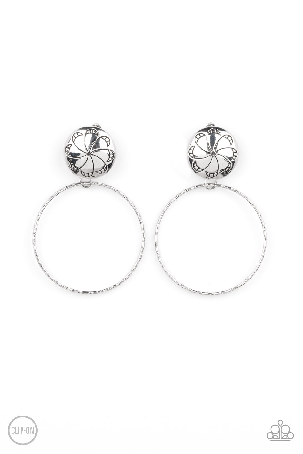 Rural Renewal Silver Clip-On Earring - Paparazzi Accessories  A textured silver hoop swings from the bottom of a silver fitting stamped in a frilly floral pattern, creating a whimsical display. Earring attaches to a standard clip-on fitting.  Sold as one pair of clip-on earrings.
