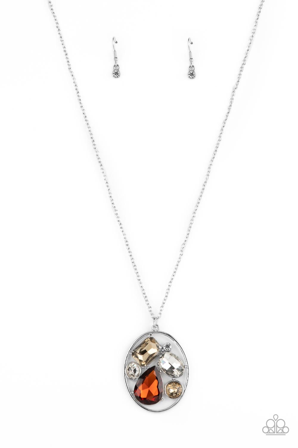 Scandalously Scattered Brown Necklace - Paparazzi Accessories  Varying in cut and shimmer, a mismatched collection of white, golden topaz, and classic topaz rhinestones haphazardly coalesce inside an oval silver frame, creating a mesmerizing pendant at the bottom of an extended silver chain. Features an adjustable clasp closure.  Sold as one individual necklace. Includes one pair of matching earrings.
