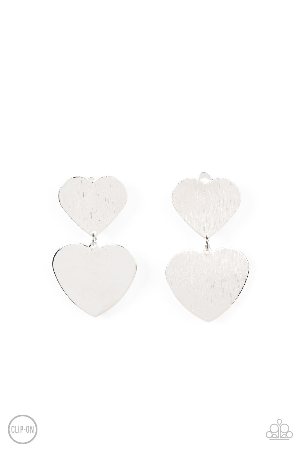 Cowgirl Crush Silver Clip-On Earring - Paparazzi Accessories  Featuring a shimmery scratched finish, an oversized silver heart charm swings from the bottom of a smaller silver heart charm, resulting in a flirtatious lure. Earring attaches to a standard clip-on fitting.  Sold as one pair of clip-on earrings.