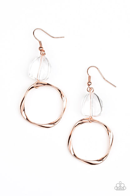 All Clear Copper Earring - Paparazzi Accessories  An imperfect crystal-like gem gives way to a twisted shiny copper hoop, resulting in a refined asymmetrical display. Earring attaches to a standard fishhook fitting.  All Paparazzi Accessories are lead free and nickel free!  Sold as one pair of earrings.