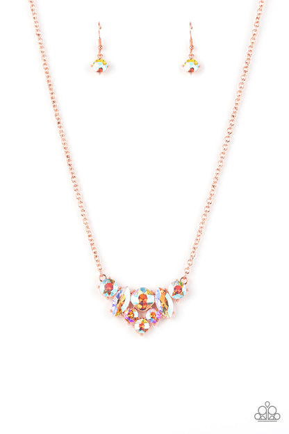 Lavishly Loaded Copper Necklace - Paparazzi Accessories  A glittering collection of marquise and round peach-colored gems encased in studded copper fittings, coalesce into a lavish frame that gives way to a classic shiny copper chain resulting in a glamorous finish below the collar. Features an adjustable clasp closure.  All Paparazzi Accessories are lead free and nickel free!  Sold as one individual necklace. Includes one pair of matching earrings.