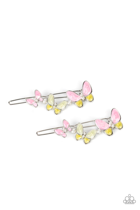 Bushels of Butterflies Pink Hair Clip - Paparazzi Accessories  Accented with dainty pearl beads, a kaleidoscope of brightly painted pink butterflies flutter across the top of a silver clip. Features a standard hair clip on the back.  Sold as a pair of two hair clips.