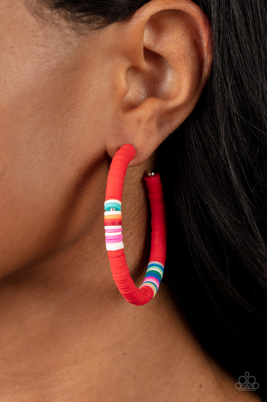 Colorfully Contagious Red Hoop Earring - Paparazzi Accessories  Rubbery red, blue, green, pink, orange, yellow, and white bands are threaded along an oversized silver hoop, creating a courageous pop of color. Earring attaches to a standard post fitting. Hoop measures approximately 2 1/4" in diameter.  Sold as one pair of hoop earrings.