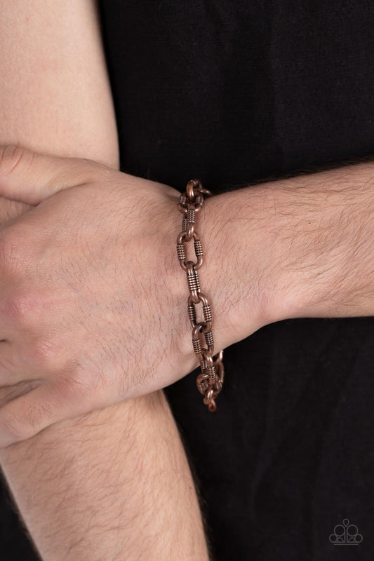 Industrial Infantry Copper Urban Bracelet - Paparazzi Accessories  Featuring gritty texture, an oversized copper chain links around the wrist for an edgy urban look. Features an adjustable clasp closure.  Sold as one individual bracelet.  Get The Complete Look!  Necklace: "Rural Recruit - Copper" (Sold Separately)