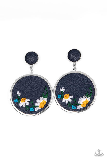 Embroidered Gardens Blue Post Earring - Paparazzi Accessories  A small Rhodonite leather disc, encased in a simple silver frame, anchors a larger Rhodonite circle that is adorned with fanciful embroidered flowers creating a whimsical lure. Earring attaches to a standard post fitting.  Sold as one pair of post earrings.