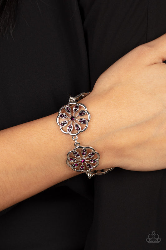 Blooming Bling Purple Bracelet - Paparazzi Accessories  Adorned with purple rhinestone floral accents, scalloped silver frames delicately link around the wrist for a sparkly seasonal fashion. Features an adjustable clasp closure.  All Paparazzi Accessories are lead free and nickel free!  Sold as one individual bracelet.