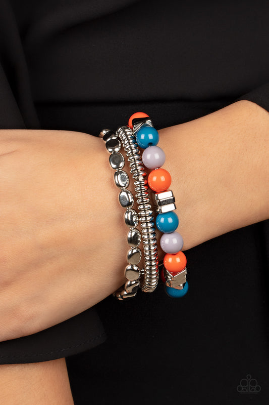 Tour de Tourist Multi Bracelet - Paparazzi Accessories  A mismatched collection of silver discs, silver cubes, bubbly multicolored acrylic, and silver pebble-like beads are threaded along stretchy bands around the wrist, creating fiery layers.  All Paparazzi Accessories are lead free and nickel free!  Sold as one set of three bracelets.
