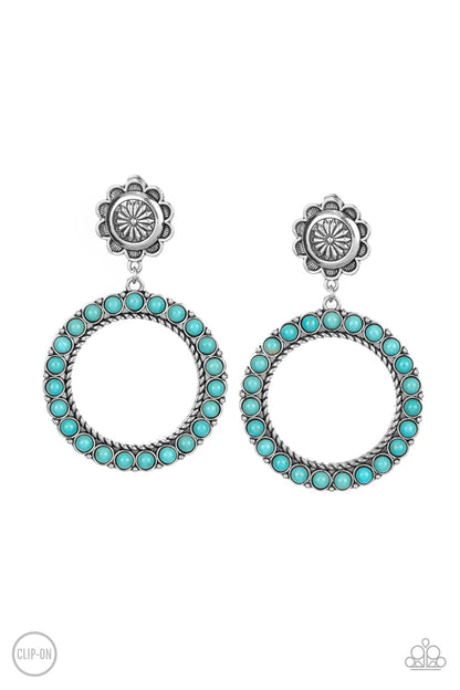 Playfully Prairie - Blue Item #P5CO-BLXX-056XX Featuring studded and twisted rope-like silver accents, a turquoise stone dotted hoop swings from the bottom of a rustic silver flower for a whimsically floral fashion. Earring attaches to a standard clip-on fitting.  Sold as one pair of clip-on earrings.