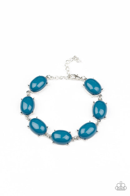 Confidently Colorful - Blue Item #P9WH-BLXX-258XX Featuring pronged silver fittings, an oversized collection of oval Mykonos Blue beads delicately link around the wrist for a dramatic pop of color. Features an adjustable clasp closure.  Sold as one individual bracelet.