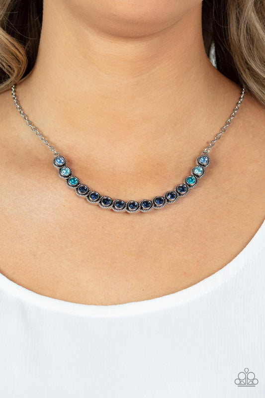 Throwing SHADES Blue Necklace - Paparazzi Accessories  Encased in studded silver fittings, a glittery ombré of blue rhinestones delicately bows below the collar, creating an enchanting pop of color. Features an adjustable clasp closure.  Sold as one individual necklace. Includes one pair of matching earrings.