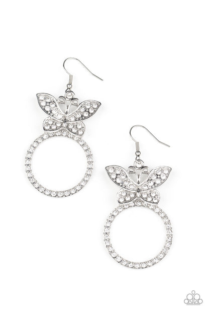 Paradise Found White Butterfly Earring - Paparazzi Accessories  A white rhinestone encrusted silver butterfly flutters atop a silver ring dotted in matching white rhinestones, resulting in a dazzling statement piece. Earring attaches to a standard fishhook fitting.  All Paparazzi Accessories are lead free and nickel free!  Sold as one pair of earrings.