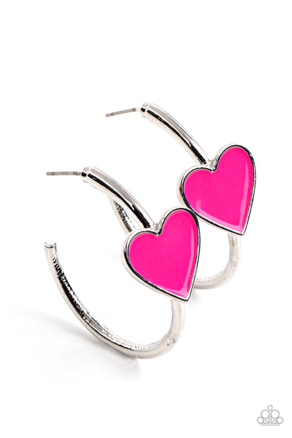 Kiss Up Pink Hoop Earring - Paparazzi Accessories  A charming Fuchsia Fedora heart adorns the front of a classic silver hoop resulting in a whimsical fashion. Earring attaches to a standard post fitting. Hoop measures approximately 1 1/4" in diameter.  All Paparazzi Accessories are lead free and nickel free!  Sold as one pair of hoop earrings.