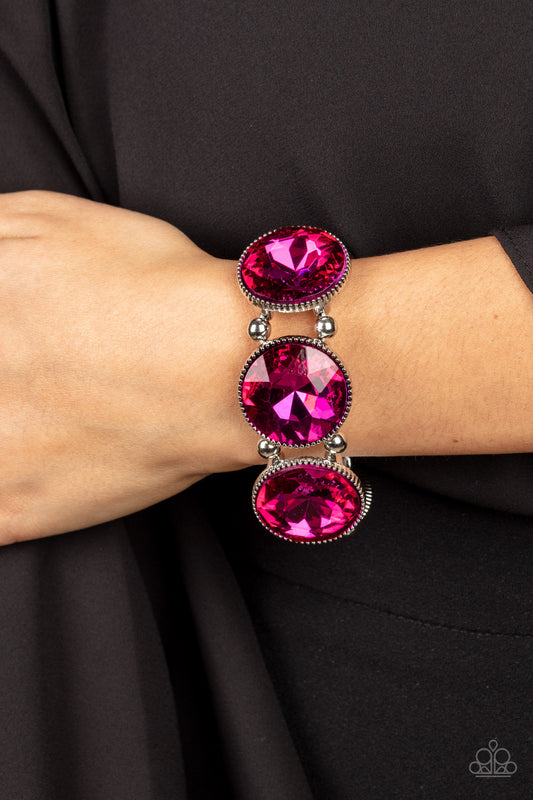Powerhouse Hustle Pink Bracelet - Paparazzi Accessories  Infused with pairs of silver beads, a glitzy collection of dramatically oversized Fuchsia Fedora rhinestone frames are threaded along stretchy bands around the wrist for a jaw-dropping dazzle.  Sold as one individual bracelet.