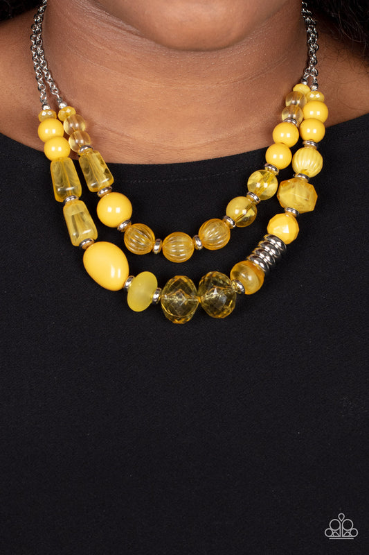 Pina Colada Paradise Yellow Necklace - Paparazzi Accessories  Varying in shape, size, and opacity, a refreshing collection of mustard yellow acrylic and crystal-like beads join silver discs along invisible wires that flawlessly layer below the collar for an earthy pop of color. Features an adjustable clasp closure.  Sold as one individual necklace. Includes one pair of matching earrings.