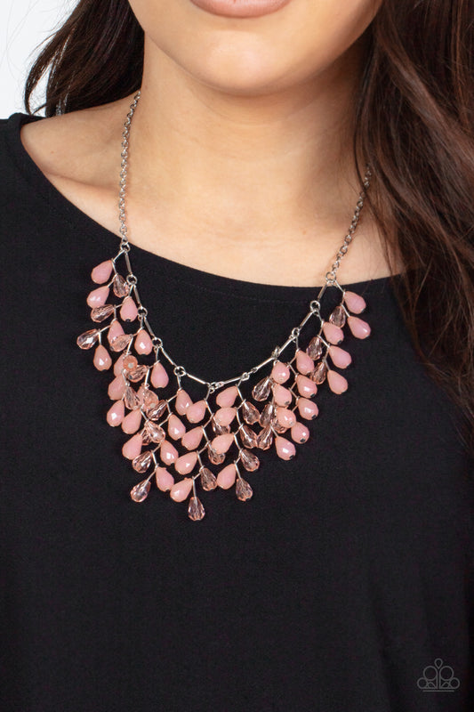 Garden Fairytale - Pink Item #P2ST-PKXX-107XX A shimmery collection of opaque and clear crystal-like Pale Rosette teardrop beads delicately cluster along a linked strand of silver bars, creating an ethereally leafy fringe below the collar. Features an adjustable clasp closure.  Sold as one individual necklace. Includes one pair of matching earrings.