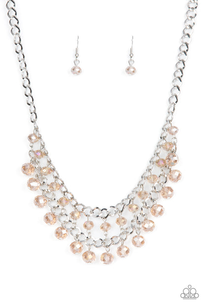 Urban Palace - Brown Item #P2ST-BNXX-069XX Flecked in iridescence, two rows of brown crystal-like beads cascade from the bottom of two interlocking silver chains, resulting in a radiant fringe below the collar. Features an adjustable clasp closure.  Sold as one individual necklace. Includes one pair of matching earrings.