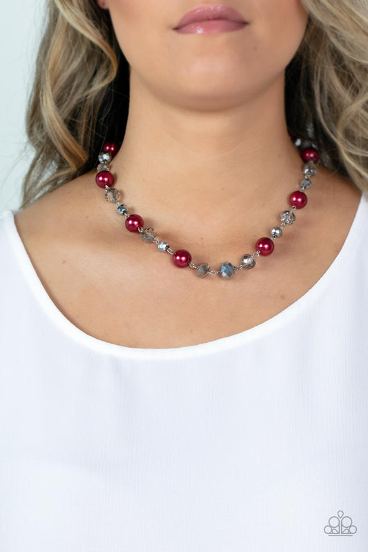 Decked Out Dazzle Red Necklace - Paparazzi Accessories  A glamorous collection of oversized pearly red beads, metallic-flecked and smoky crystal-like beads delicately links below the collar, resulting a glitzy pop of color. Features an adjustable clasp closure.  Sold as one individual necklace. Includes one pair of matching earrings.