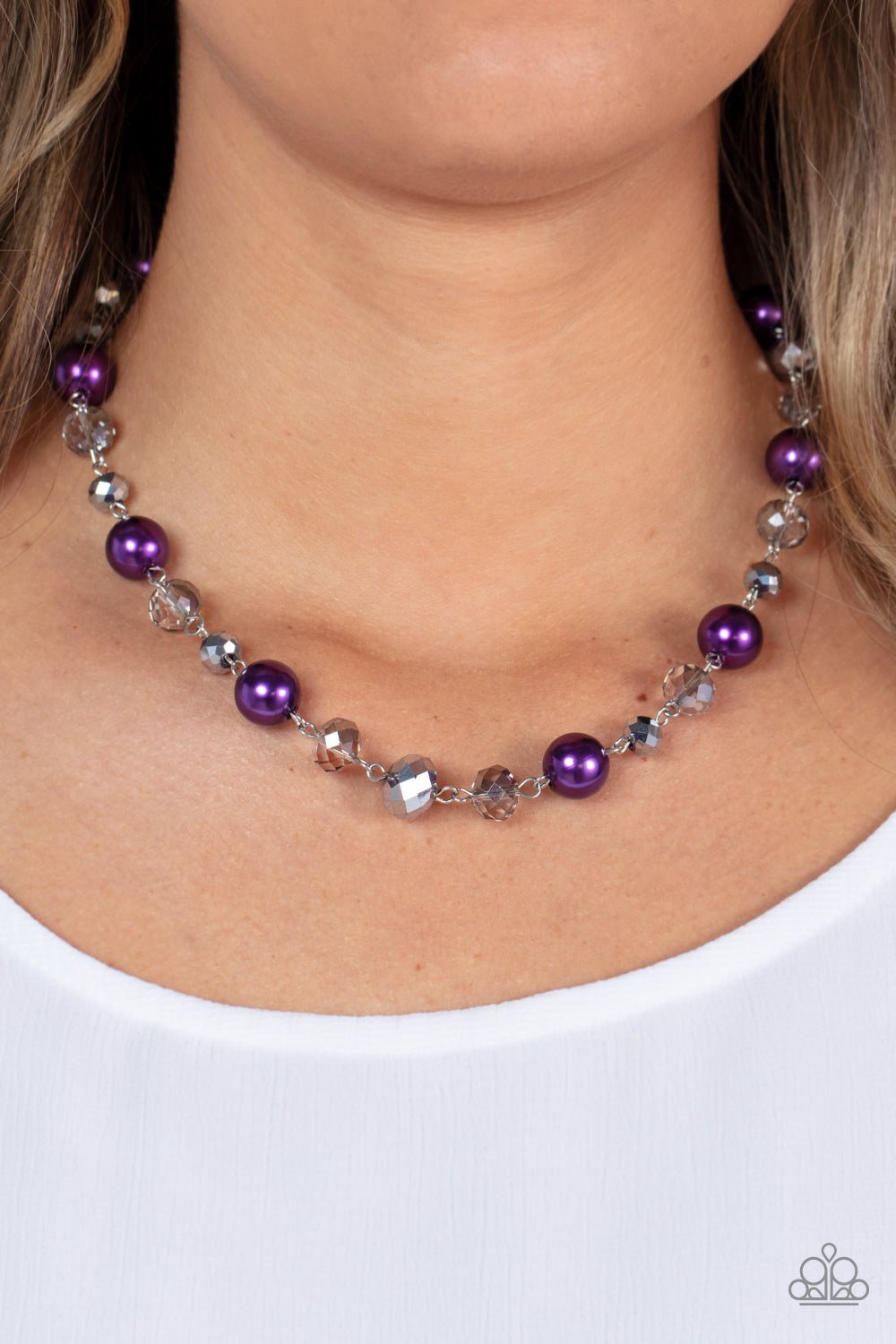 Decked Out Dazzle Purple Necklace - Paparazzi Accessories  A glamorous collection of oversized pearly purple beads, metallic-flecked and smoky crystal-like beads delicately link below the collar, resulting in a glitzy pop of color. Features an adjustable clasp closure.  Sold as one individual necklace. Includes one pair of matching earrings.