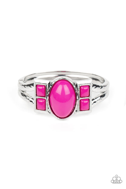 A Touch of Tiki Pink Hinge Bracelet - Paparazzi Accessories  An oversized oval Fuchsia Fedora bead is flanked by pairs of stacked Fuchsia Fedora square beads across the center of a hammered silver bangle-like bracelet, creating a bold pop of color atop the wrist. Features a hinged closure.  Sold as one individual bracelet.