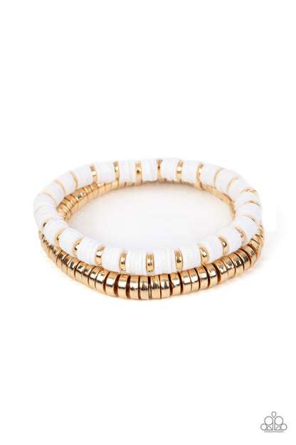 Catalina Marina White Bracelet - Paparazzi Accessories  Infused with stretchy bands, a row of gold disc beads joins a strand of rubbery white and gold discs around the wrist, resulting in a modern duo.  Sold as one pair of bracelets.