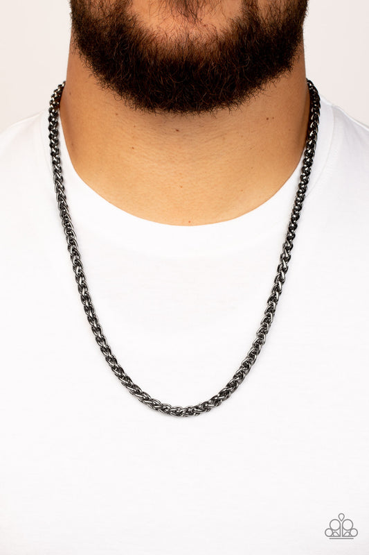 Metro Monopoly Black Urban Necklace - Paparazzi Accessories  A bold strand of gunmetal wheat chain drapes across the chest for an edgy urban fashion. Features an adjustable clasp closure.  Sold as one individual necklace.