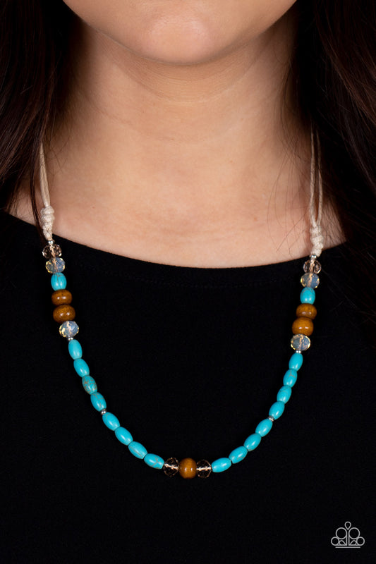 Groundbreaking Glamour Blue Urban Necklace - Paparazzi Accessories  An earthy assortment of brown wooden, turquoise stone, and crystal-like beads are knotted in place along the bottom of shiny cording below the collar for a naturally beautiful finish. Features an adjustable clasp closure.  Sold as one individual necklace.