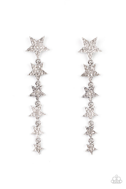 Americana Attitude White Rhinestone Star Post Earring - Paparazzi Accessories  Dotted with dainty white rhinestones, a stellar collection of silver stars graduate in size as they cascade from the ear for an out-of-this-world fashion. Earring attaches to a standard post fitting.  Featured inside The Preview at GLOW! Sold as one pair of post earrings.  New KitNew Kit