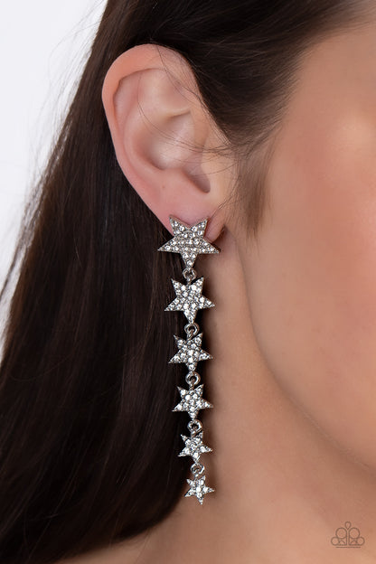 Americana Attitude White Rhinestone Star Post Earring - Paparazzi Accessories  Dotted with dainty white rhinestones, a stellar collection of silver stars graduate in size as they cascade from the ear for an out-of-this-world fashion. Earring attaches to a standard post fitting.  Featured inside The Preview at GLOW! Sold as one pair of post earrings.  New KitNew Kit