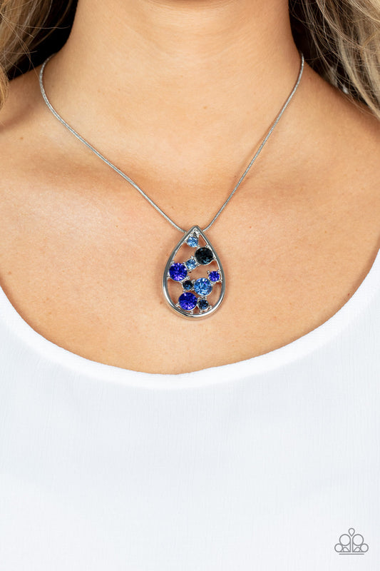 Seasonal Sophistication Blue Necklace - Paparazzi Accessories  A bubbly collection of blue, Mykonos Blue, and Spring Lake rhinestones coalesce inside an airy silver teardrop, resulting in an effervescently elegant pendant at the bottom of a rounded silver snake chain. Features an adjustable clasp closure.  Sold as one individual necklace. Includes one pair of matching earrings.