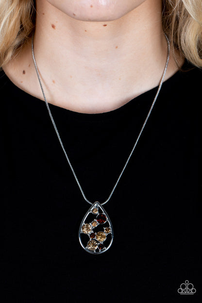 Seasonal Sophistication - Brown Item #P2RE-BNXX-277XX A bubbly collection of classic and golden topaz rhinestones coalesce inside an airy silver teardrop, resulting in an effervescently elegant pendant at the bottom of a rounded silver snake chain. Features an adjustable clasp closure.  Sold as one individual necklace. Includes one pair of matching earrings.